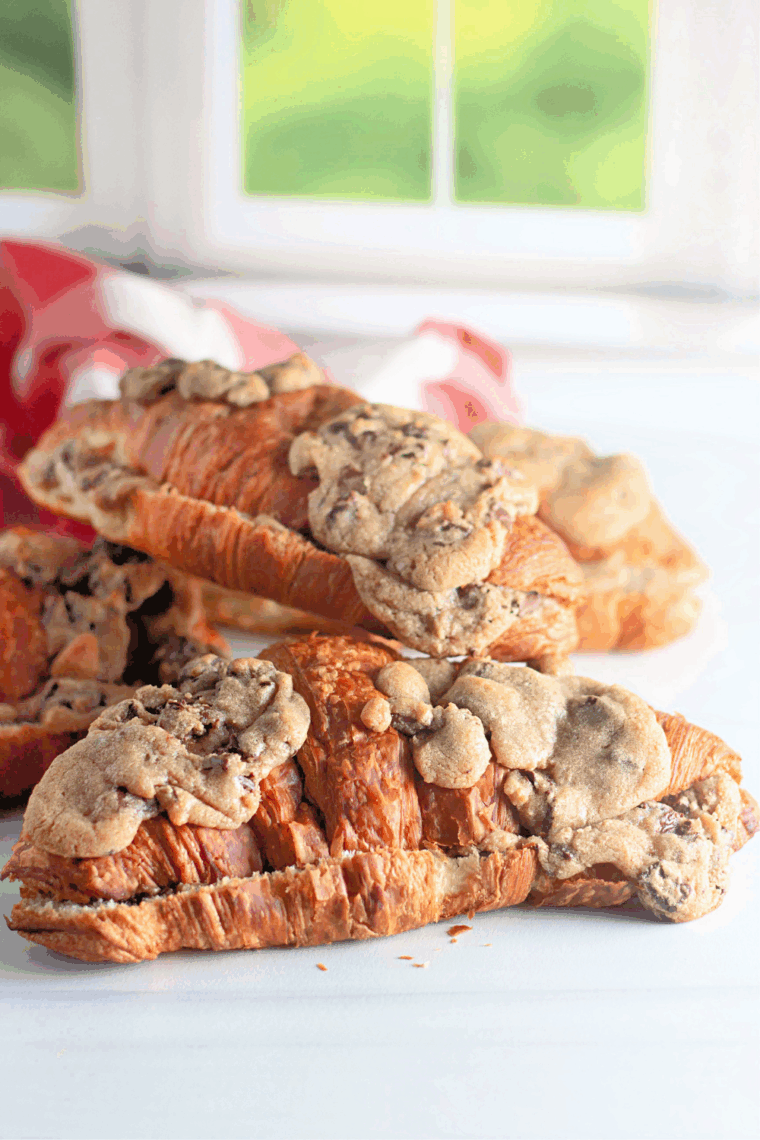 Golden brown flaky crookie with melted chocolate chip cookie dough inside, served warm.