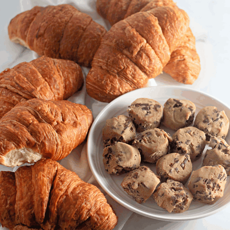Unwrap the cookie dough and place on the table next to the croissants.