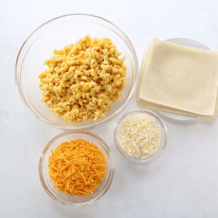 Ingredients needed for Air Fryer Mac And Cheese Egg Rolls on kitchen table.