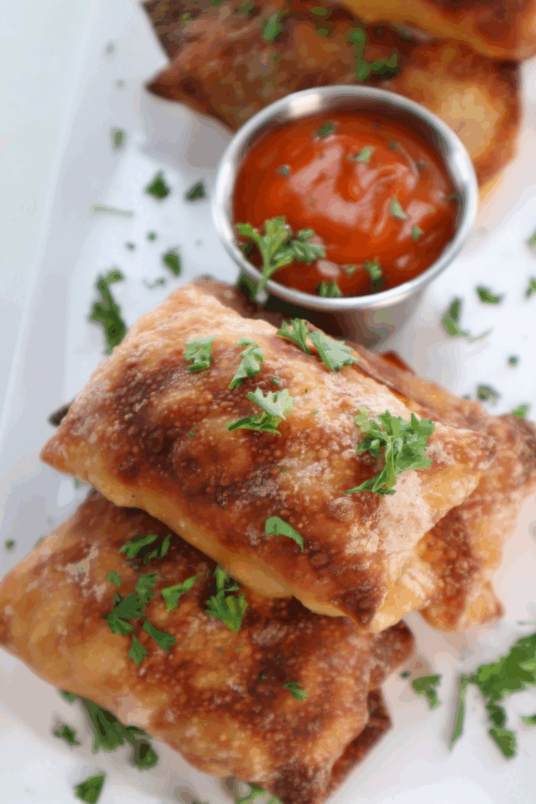 Plate of Air Fryer Mac And Cheese Egg Rolls with dipping sauce.