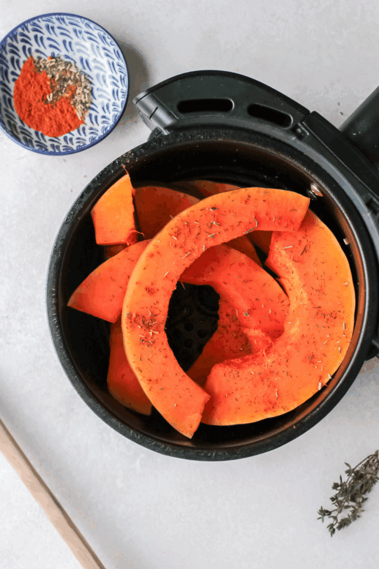 Place Pumpkin Wedges in the air fryer basket.