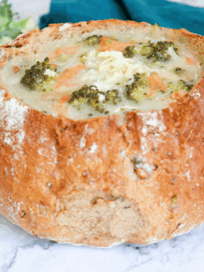 Bowl of creamy Applebee’s broccoli cheese soup topped with shredded cheddar