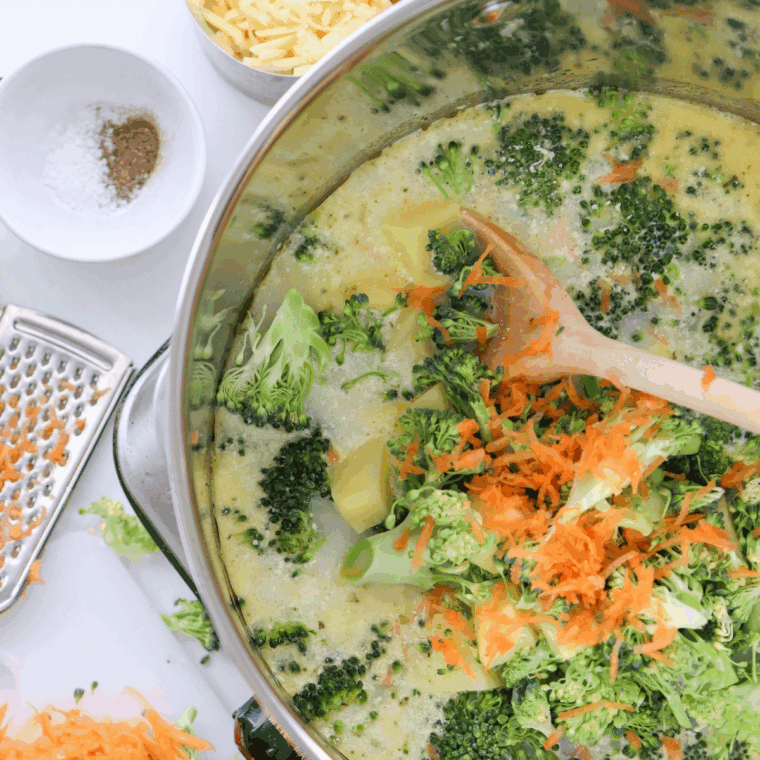 Creamy Applebee’s broccoli cheese soup in a bowl topped with melted cheddar