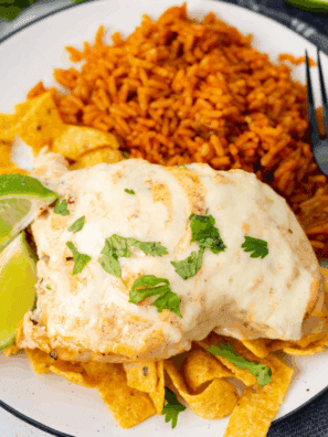 Homemade Applebee’s Fiesta Lime Chicken topped with cheese and zesty ranch-lime sauce.