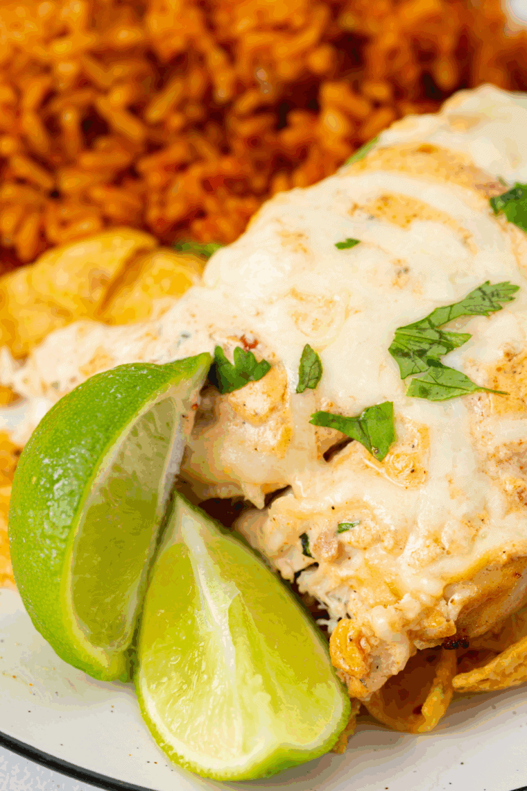 Juicy grilled Fiesta Lime Chicken topped with melted cheese and creamy lime ranch sauce served over crispy tortilla strips.