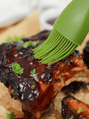 Bottle of homemade Applebee’s honey BBQ sauce with a bowl of sauce for dipping