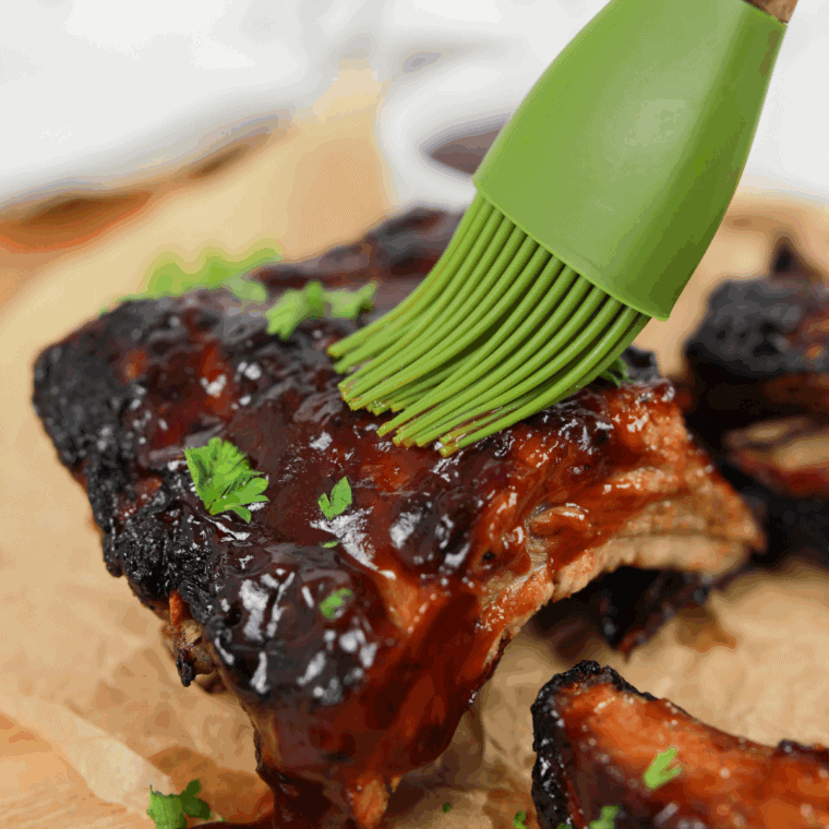 Bottle of homemade Applebee’s honey BBQ sauce with a bowl of sauce for dipping