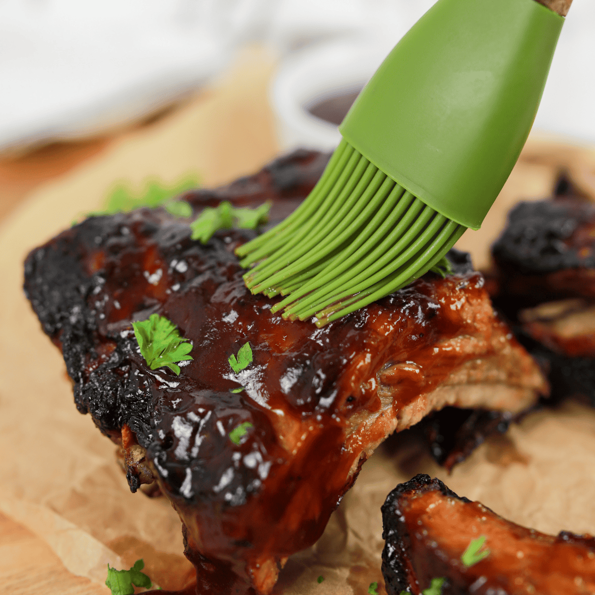Bottle of homemade Applebee’s honey BBQ sauce with a bowl of sauce for dipping