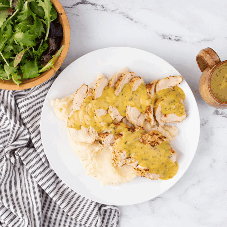 Creamy apple shells with honey mustard sauce dip in a bowl with a dip spoon.