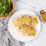 Homemade Applebee's honey mustard sauce in a small soaking bowl with chicken tender.
