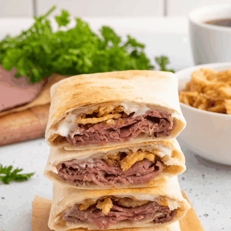 Homemade Arby’s Classic French Dip sandwich with melted provolone and au jus sauce