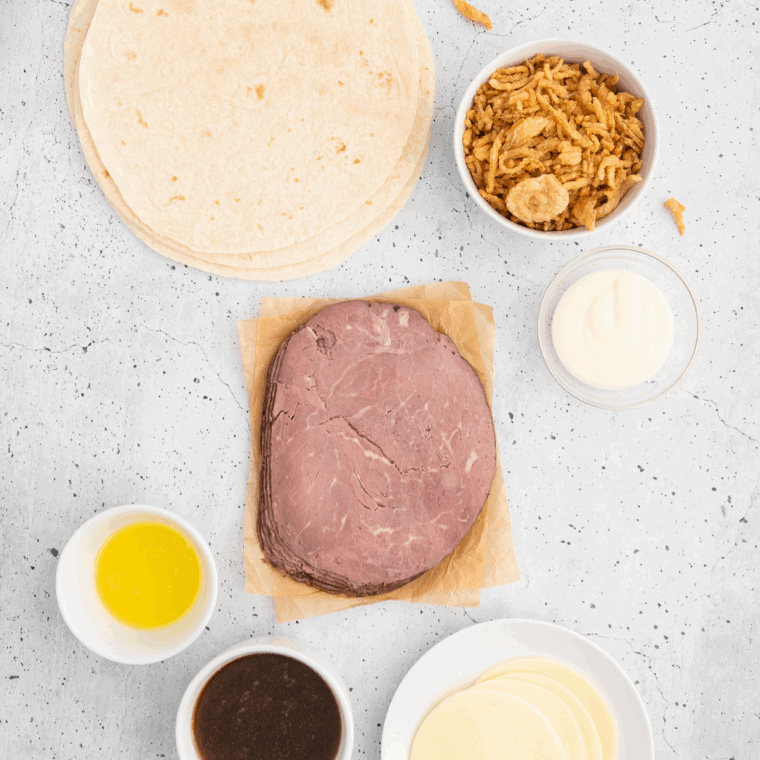 Ingredients needed for Arby's Classic French Dip Sandwich Recipe on kitchen table.