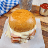 Homemade Arby’s ham and cheese melt with gooey cheese on a toasted bun.