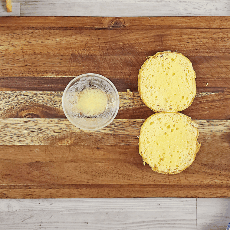 Brush butter onto the hamburger buns.