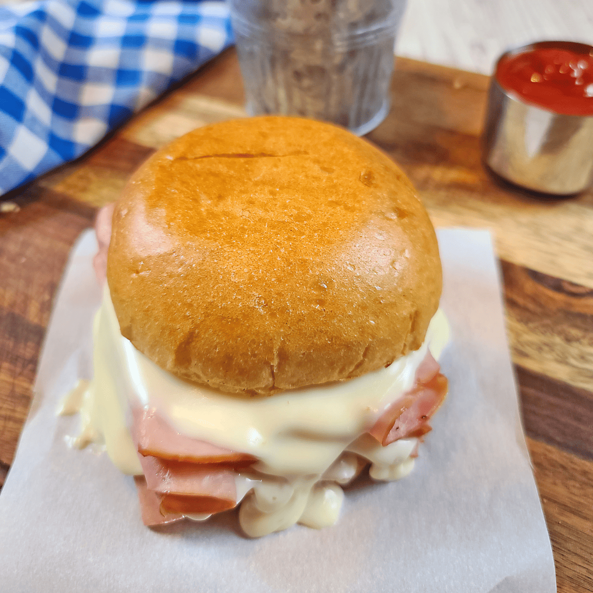 Homemade Arby’s ham and cheese melt with gooey cheese on a toasted bun.