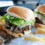 Bowl of creamy Arby’s Horsey Sauce copycat next to roast beef sandwich.