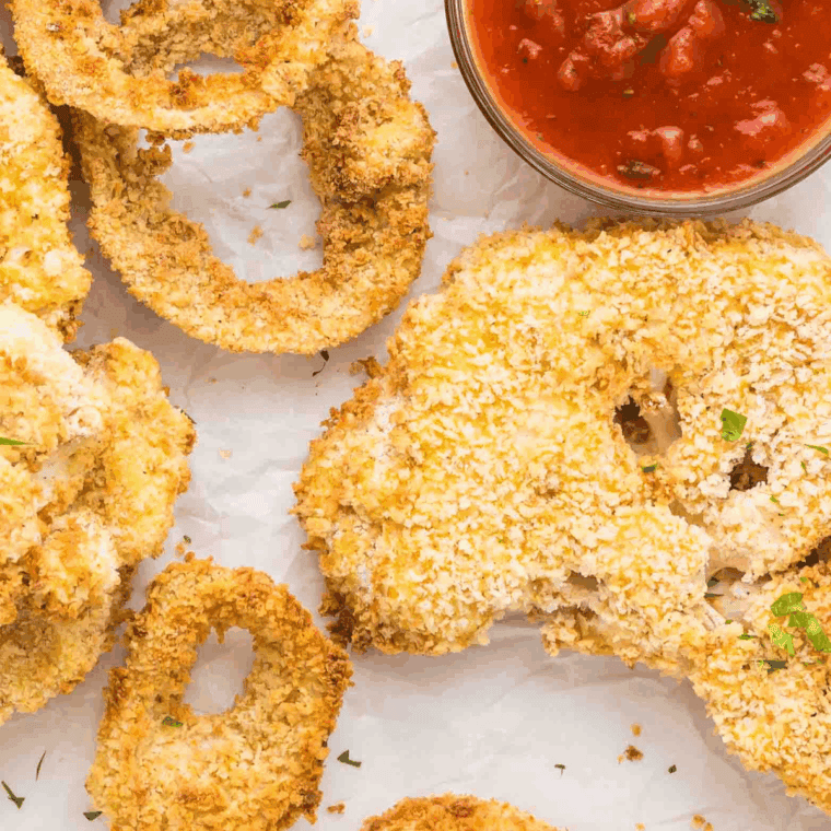 Crispy copycat Arby’s steakhouse onion rings served on parchment paper