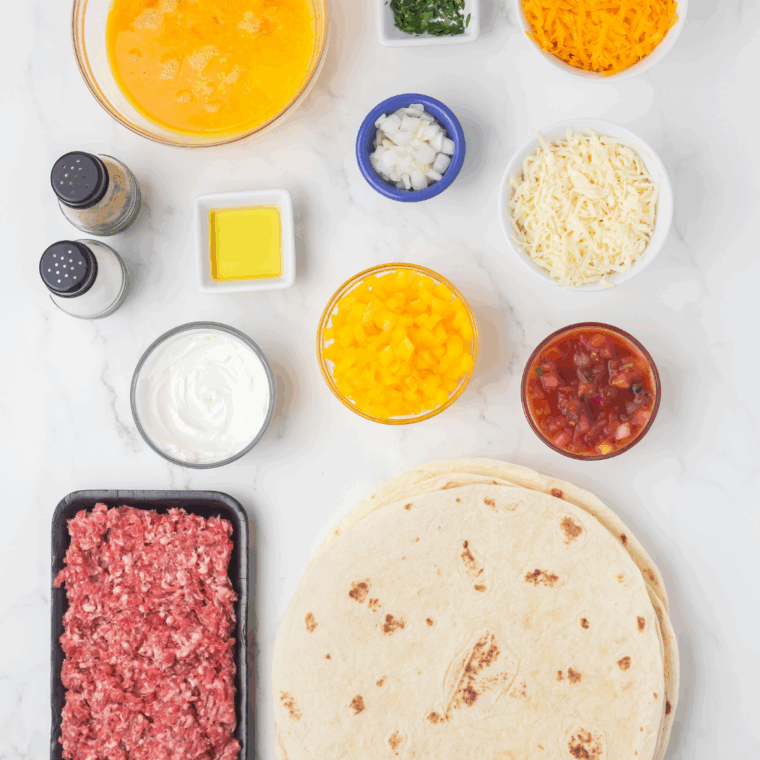 Ingredients needed for Blackstone Breakfast Quesadillas on kitchen table.