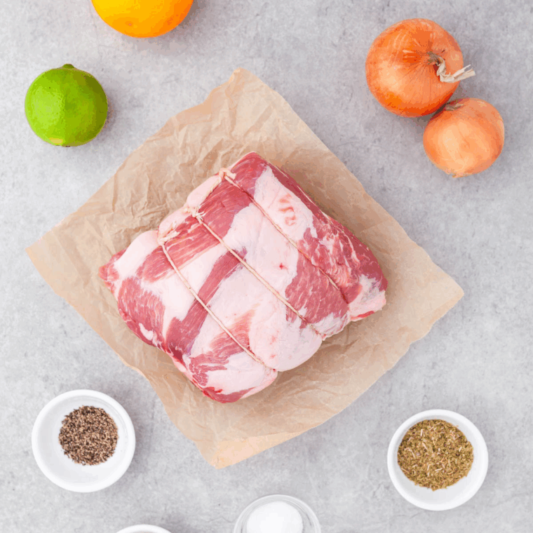 Ingredients needed for Carnitas Burrito Bowl on kitchen table.