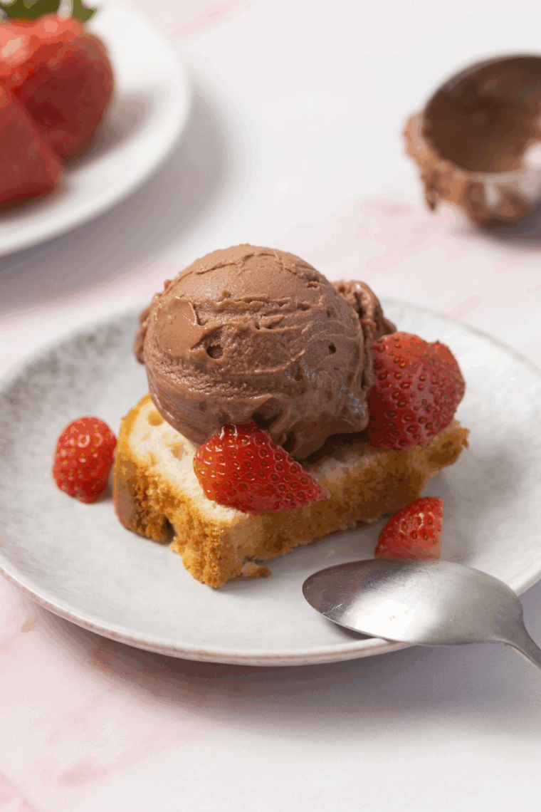 Scoop of Chocolate Covered Strawberry Protein Ice Cream (Ninja Creami) on top of keto loaf cake.