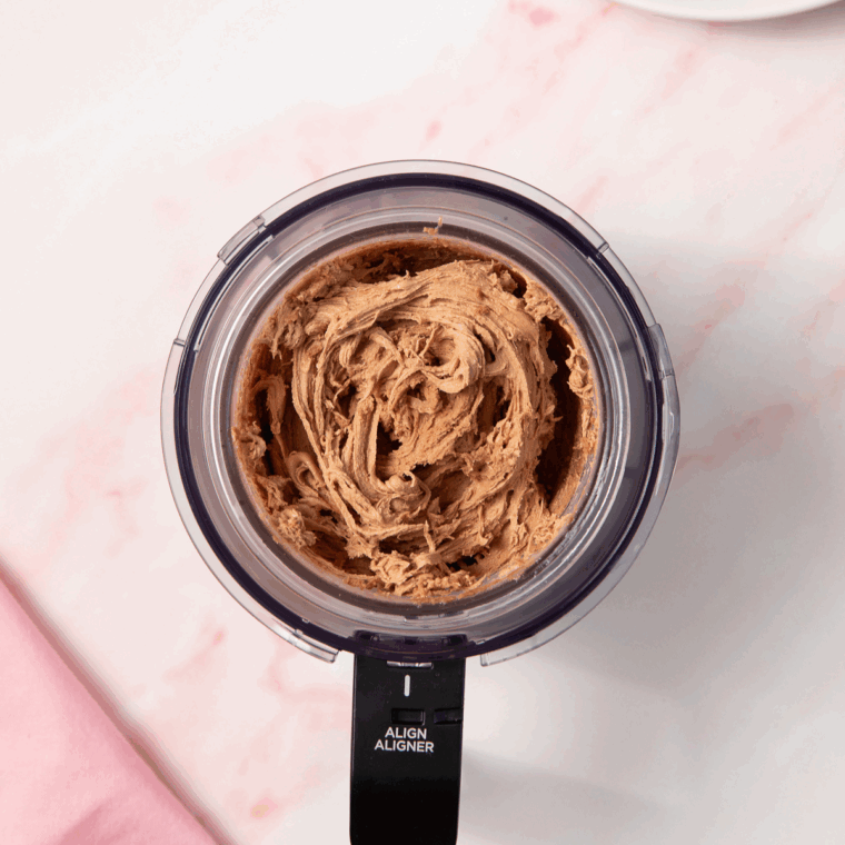 Selecting the LITE ICE CREAM setting on the Ninja Creami machine with option to RE-SPIN for a smoother texture.