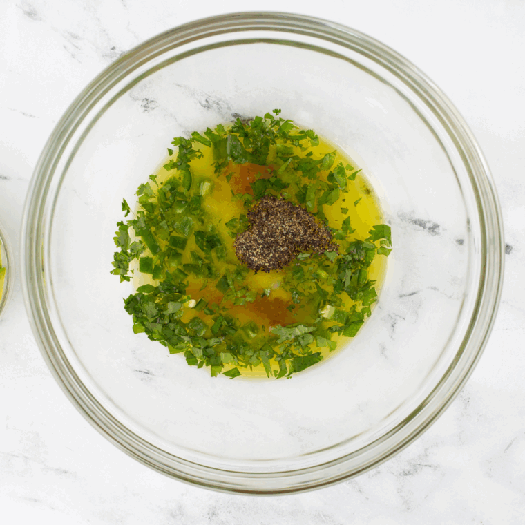 Mix Cilantro Lime Jalapeño Vinaigrette in a large mixing bowl.