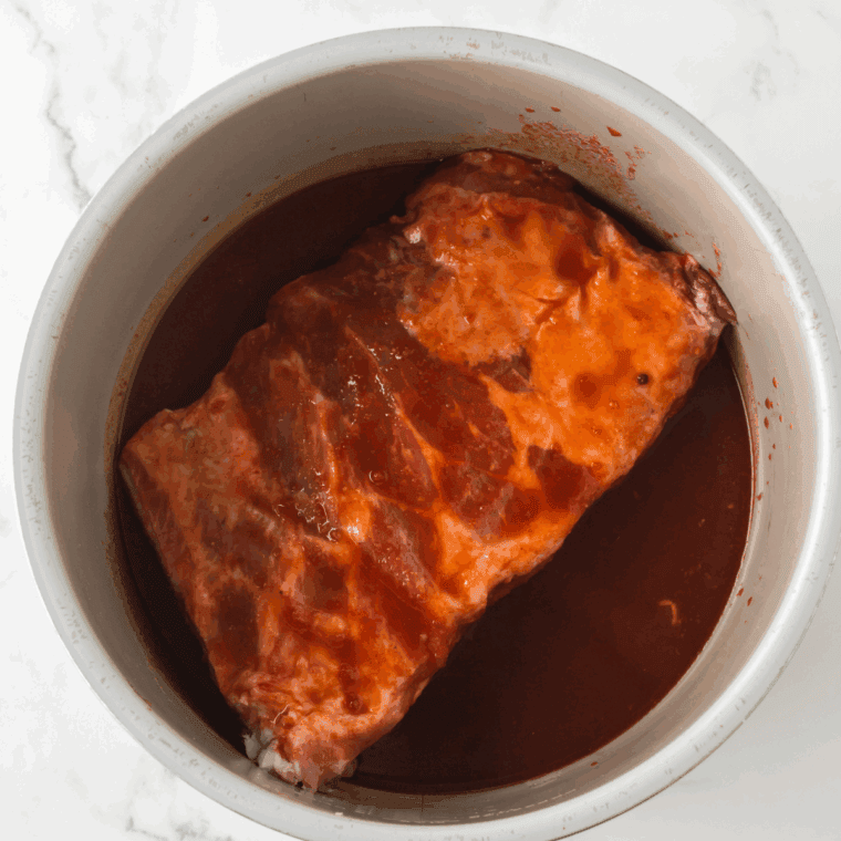 A&W BBQ sauce simmering on low heat, thickening gently