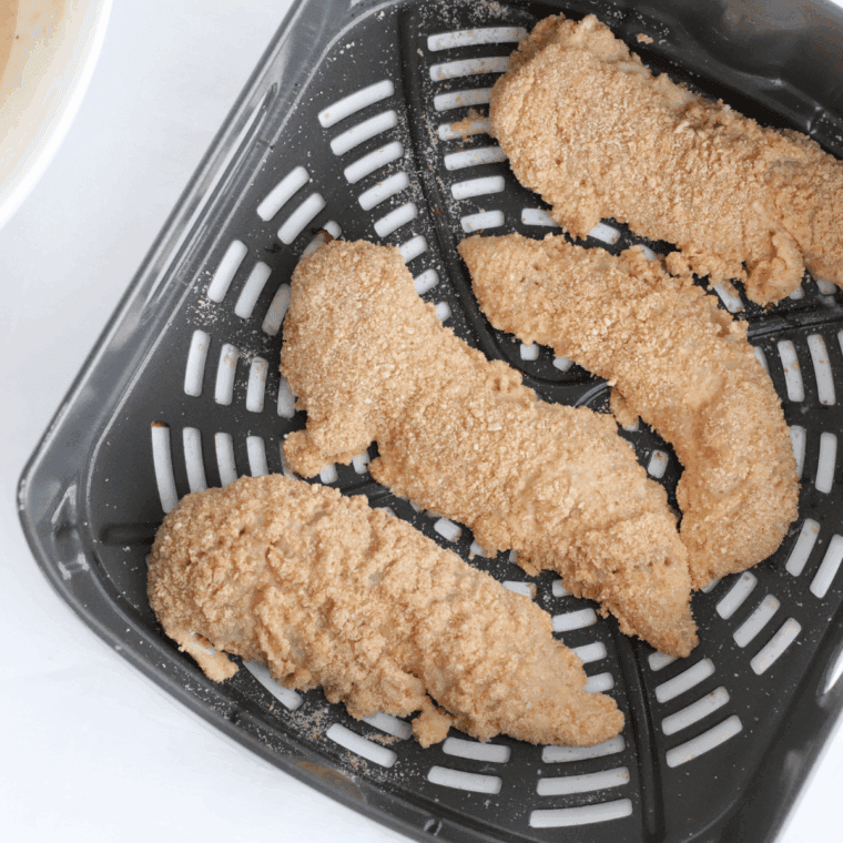 Place the chicken tenders into the air fryer basket.