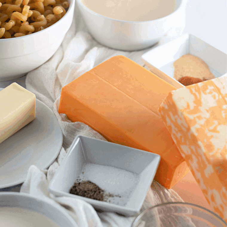 Ingredients needed for Copycat Arby’s Mac and Cheese on kitchen table.