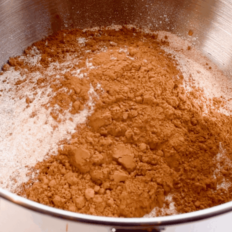Mixing yeast, warm water, and honey in a bowl to start Cheesecake Factory brown bread dough.