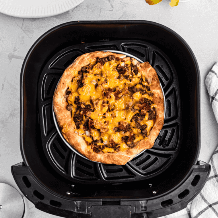 Cooked Copycat Domino's Cheeseburger Pizza Recipe in the air fryer basket.
