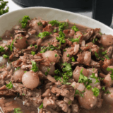 Tender copycat Golden Corral pot roast served with carrots and potatoes on a plate
