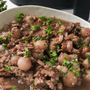 Tender copycat Golden Corral pot roast served with carrots and potatoes on a plate