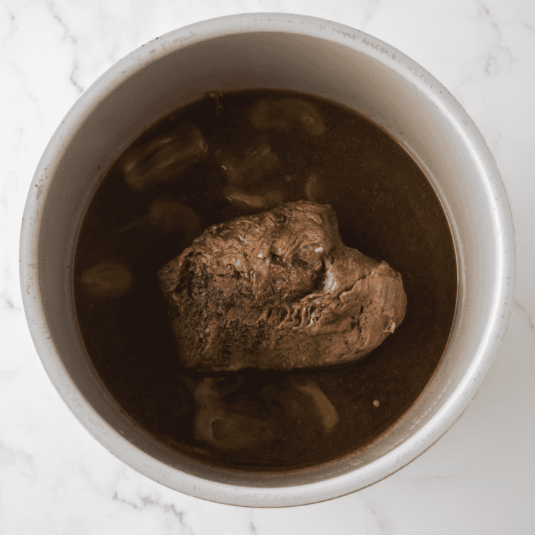 Fork-tender copycat Golden Corral pot roast being shredded with two forks