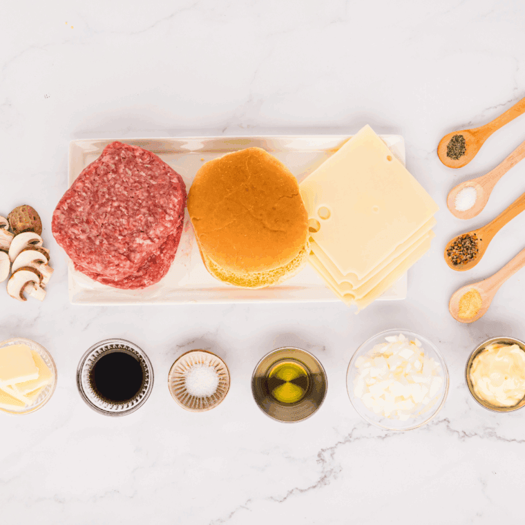 Ingredients needed for Copycat Hardee’s Mushroom Swiss Burger Recipe on kitchen table.