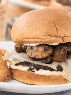Juicy mushroom Swiss burger on a bun with melted cheese and sautéed mushrooms