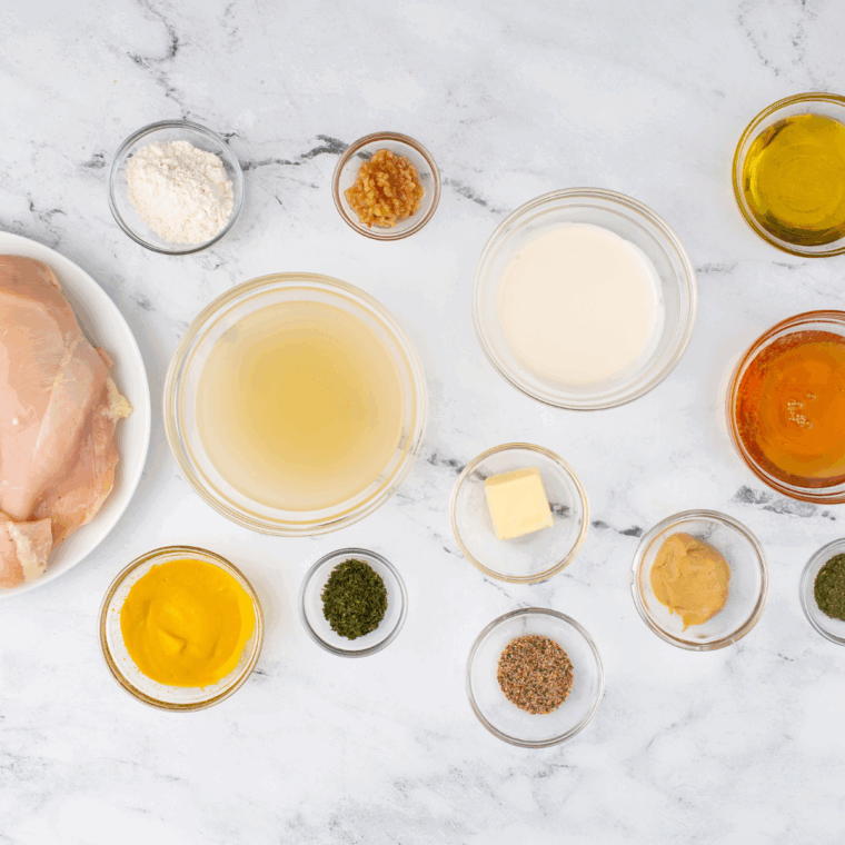 Ingredients needed for Copycat Popeyes Mardi Gras Mustard Recipe on kitchen table.