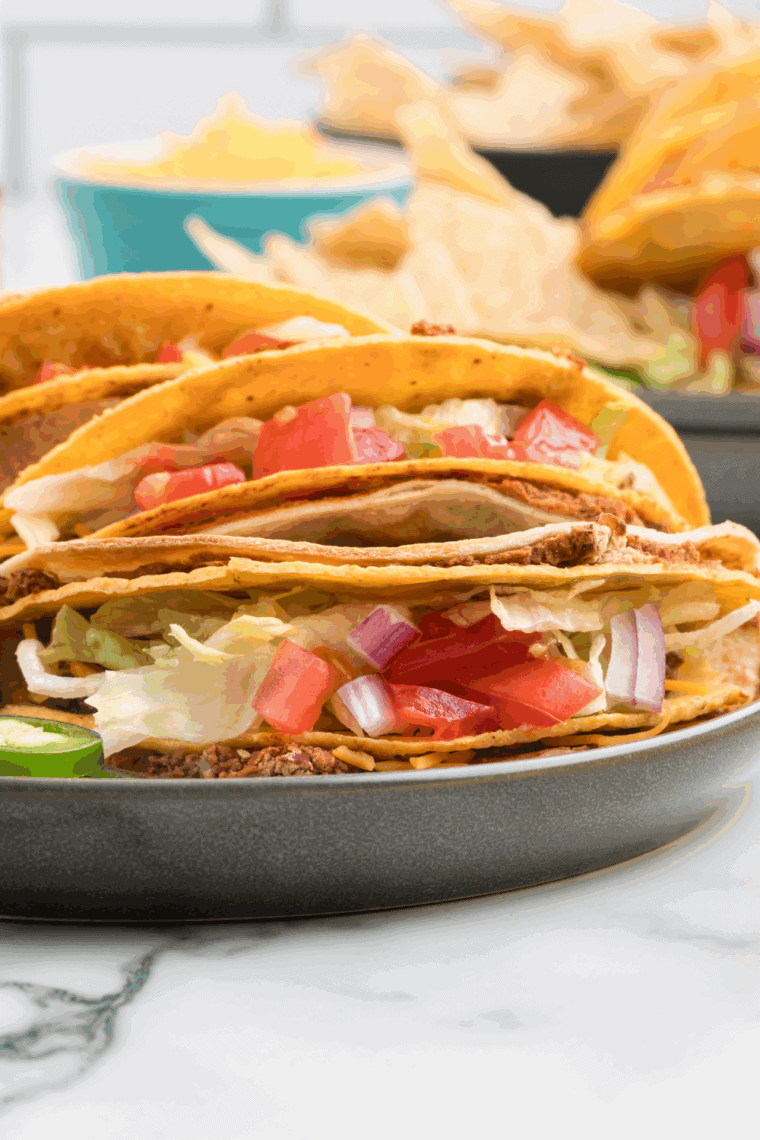 Double Decker Taco with soft tortilla, refried beans, crunchy shell, seasoned beef, lettuce, and cheese.