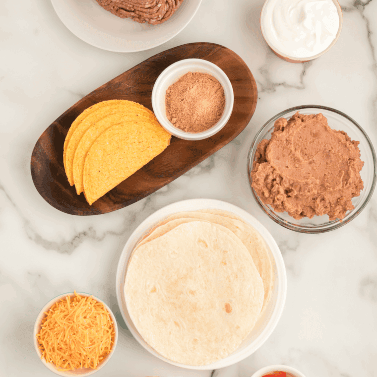 Ingredients needed for Copycat Taco Bell Double Decker Taco Recipe on kitchen table.