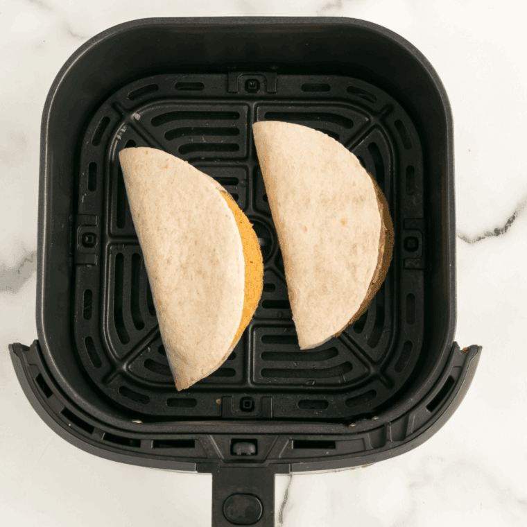 Place Copycat Taco Bell Double Decker Taco Recipe in the air fryer basket.