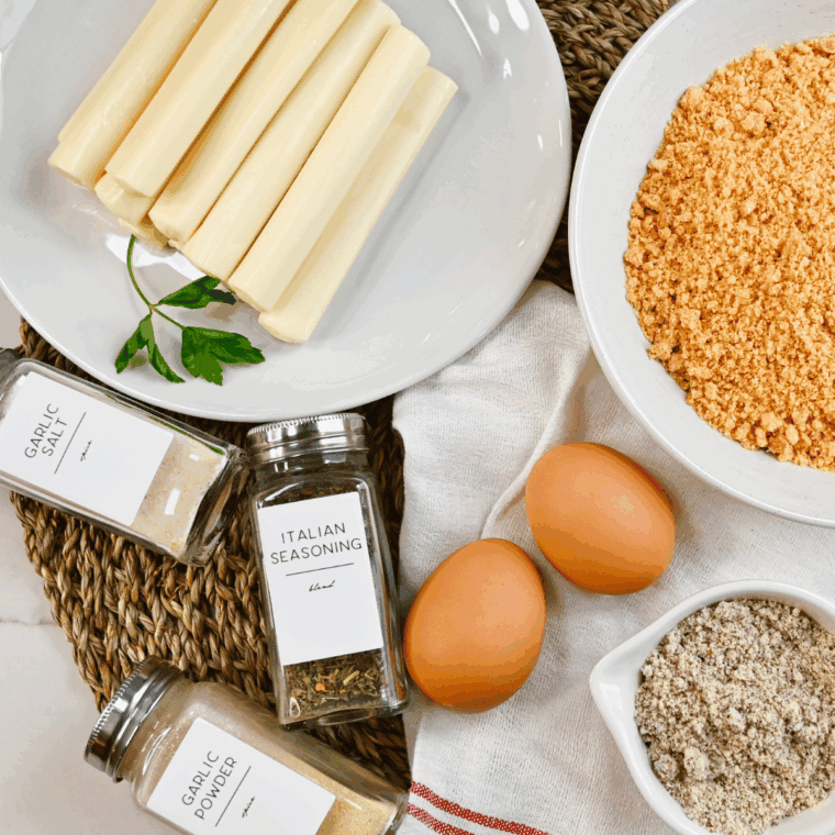 Ingredients needed for Crispy Arby’s Mozzarella Sticks Copycat Recipe on kitchen table.