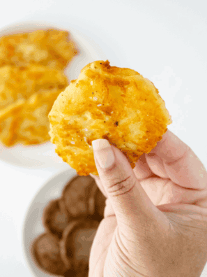 Golden, crispy Arby’s-style potato cakes stacked on a serving plate.