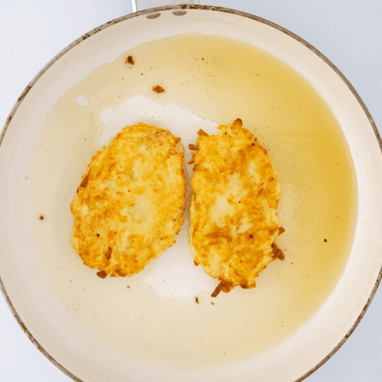 Crispy homemade Arby’s potato cakes stacked and ready to serve.