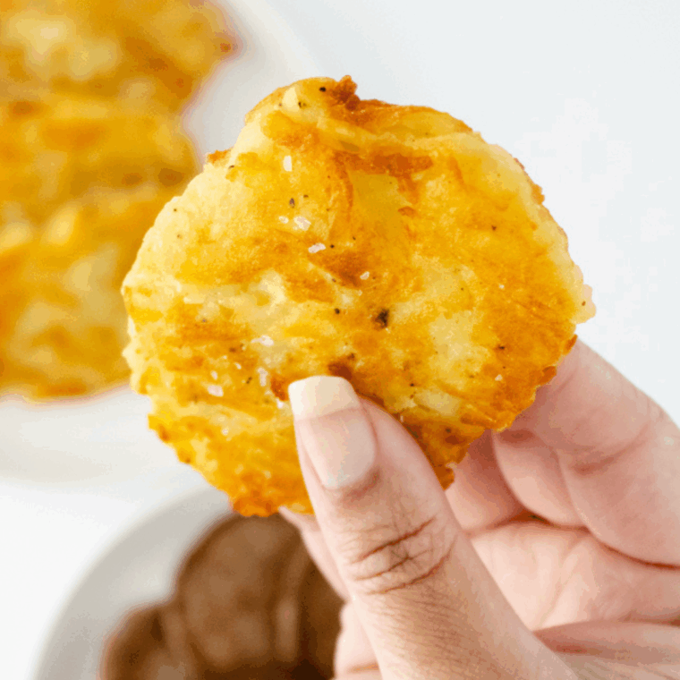 Golden-brown Arby’s-style potato cakes served on a white plate.
