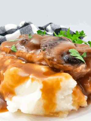 Tender pork chops smothered in brown gravy cooked in the crockpot.