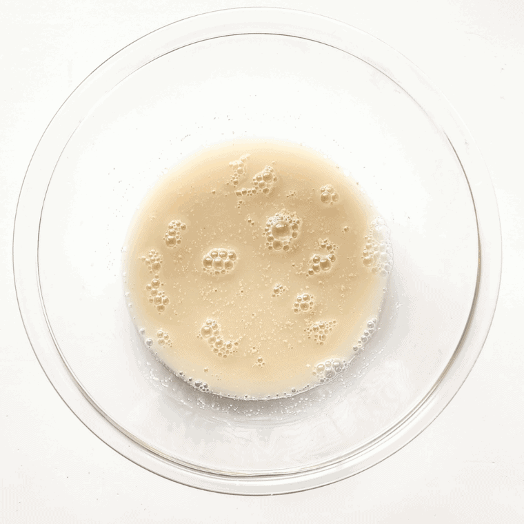 Place yeast in a small bowl with water and sugar.