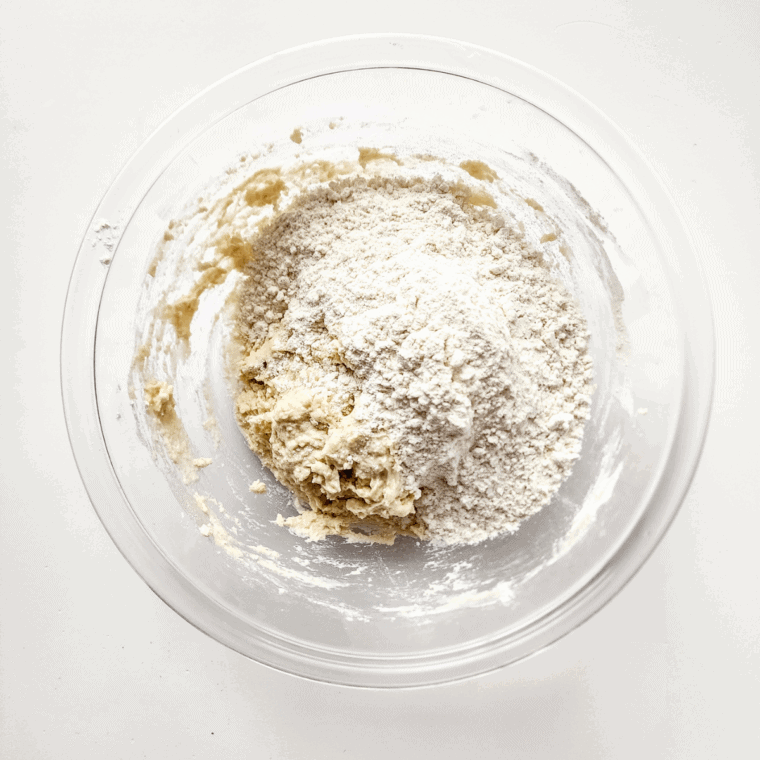 Add the flour to the yeast mixture, to form the dough.