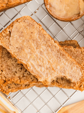 Sliced homemade banana nut bread on a wooden board, Golden Corral style.