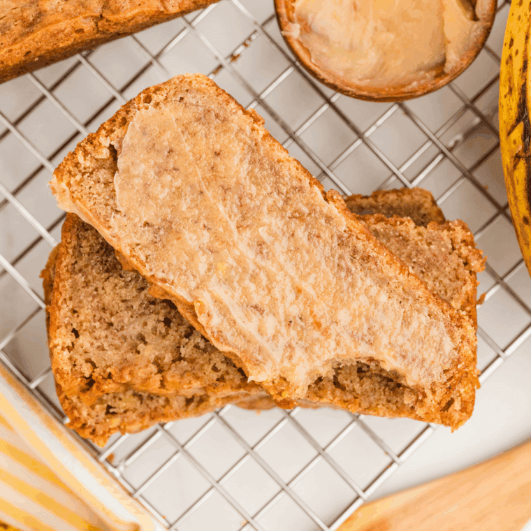 Sliced homemade banana nut bread on a wooden board, Golden Corral style.