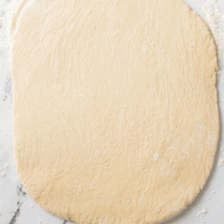Roll out the yeast dough.